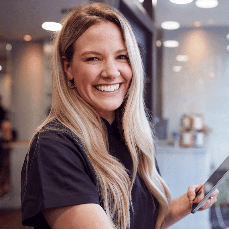 Portrait of Angela Martin, a professional stylist at Hibiscus Salon, showcasing their expertise and style.